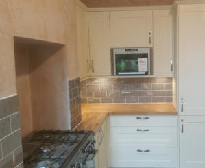 shaker kitchen with solid oak worktops built in microwave