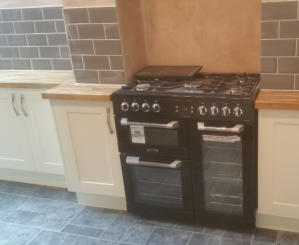 shaker kitchen with solid oak worktops and range oven