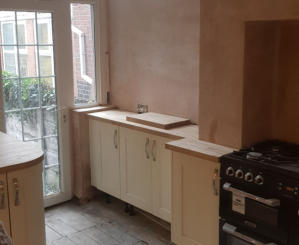 shaker kitchen with solid oak worktops and range cooker