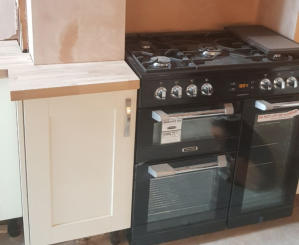 shaker kitchen with solid oak worktops and range cooker