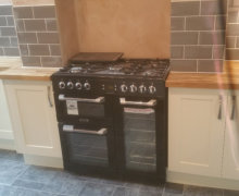 shaker kitchen with solid oak worktops and range oven