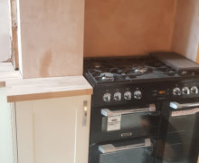 shaker kitchen with solid oak worktops and range cooker