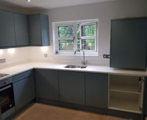 fjord green kitchen in Bramhall with white quartz worktops