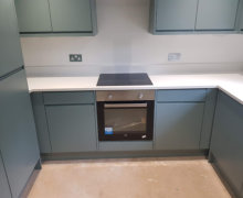 fjord green kitchen in Bramhall with white quartz worktops