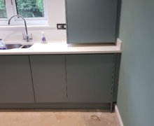 fjord green kitchen in Bramhall with white quartz worktops