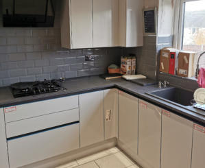 wren handleless kitchen in Ashton with compact laminate worktops