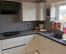 wren handleless kitchen in Ashton with compact laminate worktops