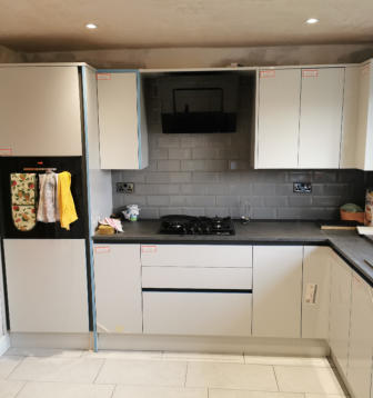 wren handleless kitchen in Ashton with compact laminate worktops