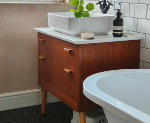 Victorian style bathroom installed in Stockport. Free standing bath, black fittings, white metro wall tiles and black hexagon floor tiles