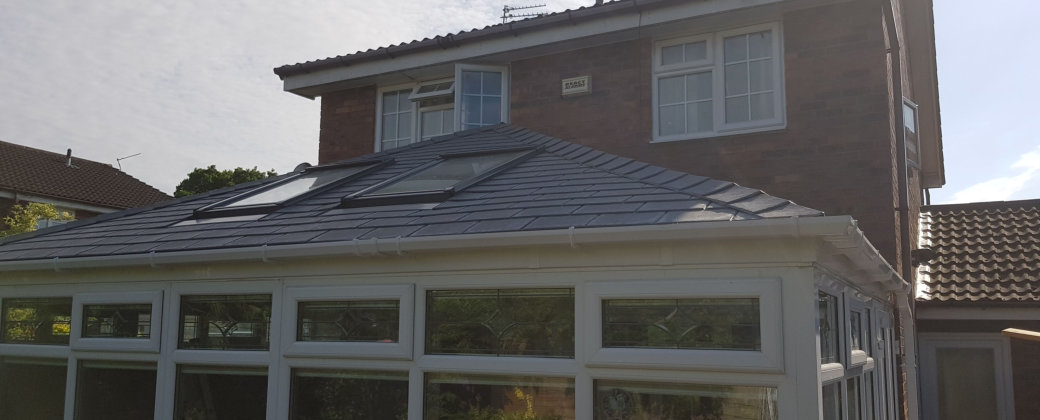 Large conservatory with solid roof in stockport