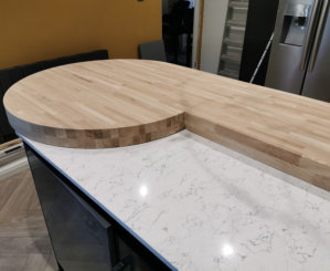 custom made solid oak worktop sat on white quartz worktop