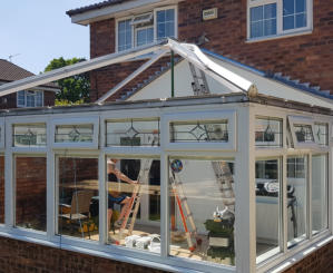 Conservatory roof being removed in Bramhall