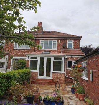 new red solid conservatory roof in Woodsmoor, Stockport